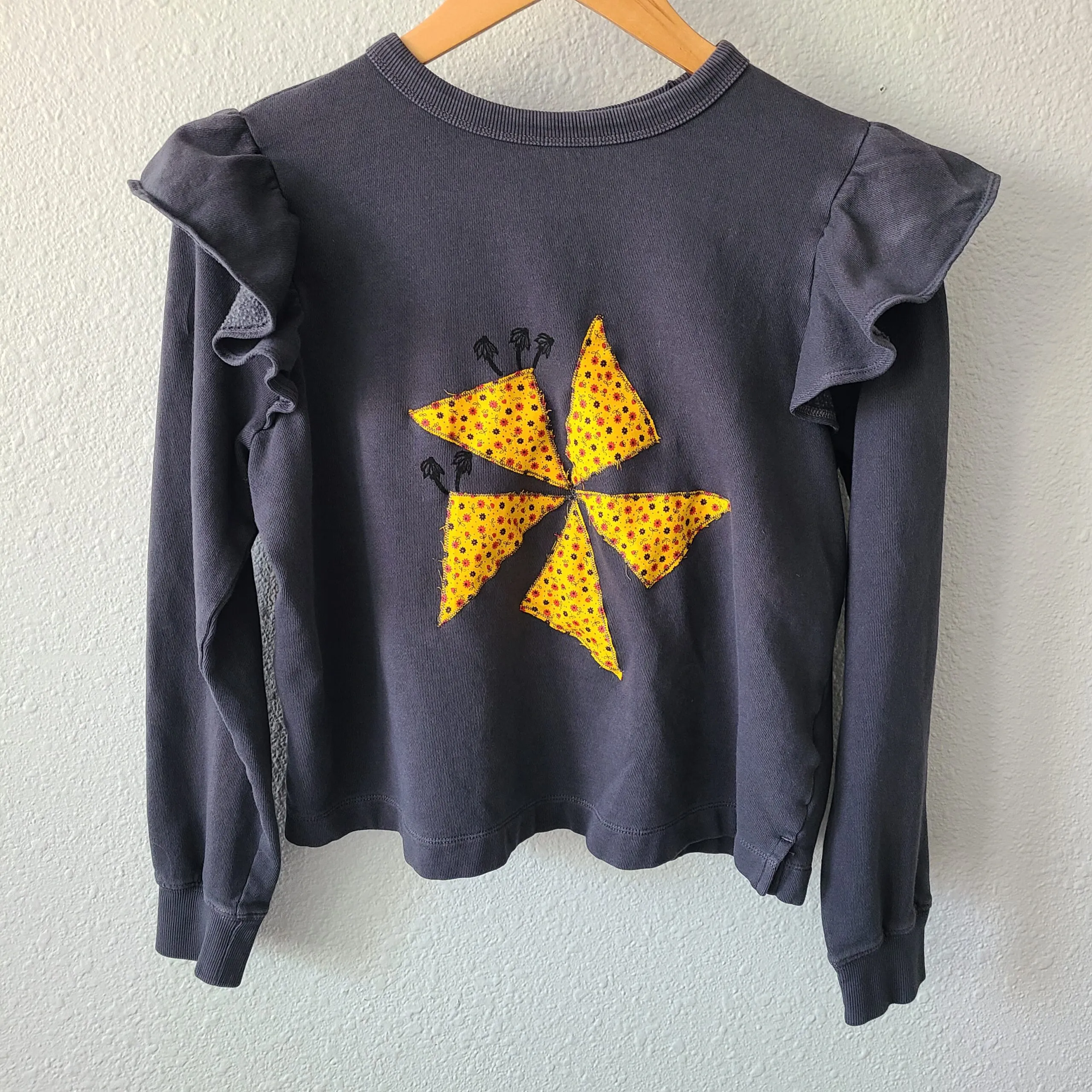 Pinwheel Quilt Pieces with Tiny Coneflower Print on Ruffle-Sleeved Sweatshirt